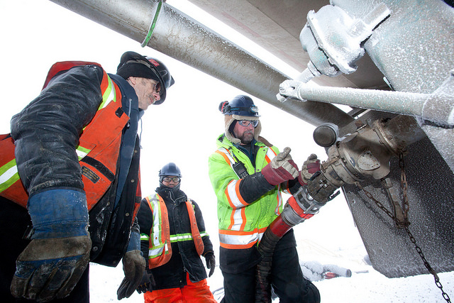 Offloading hydraulic fluid requires considerable effort to heat the oil and get it pumping in this northern location.