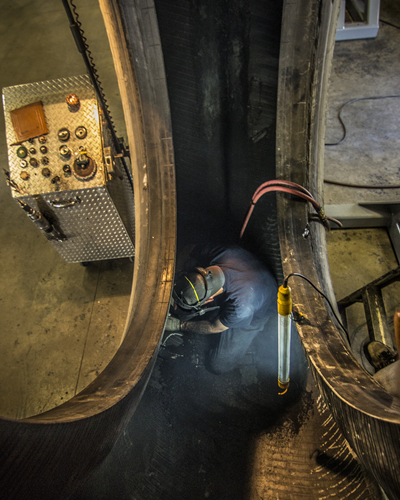 Tire technicians work in dangerous environments when executing a repair inside a truck tire. 