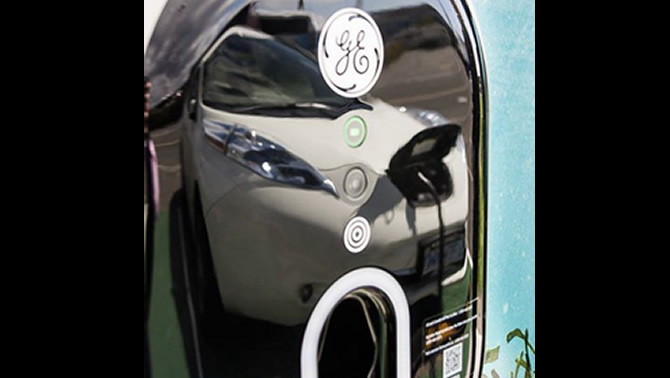 Close-up reflection of an electric car.