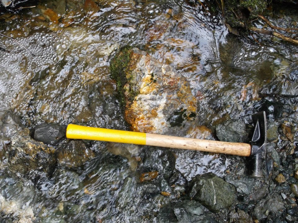 Hammer laying on some rocks