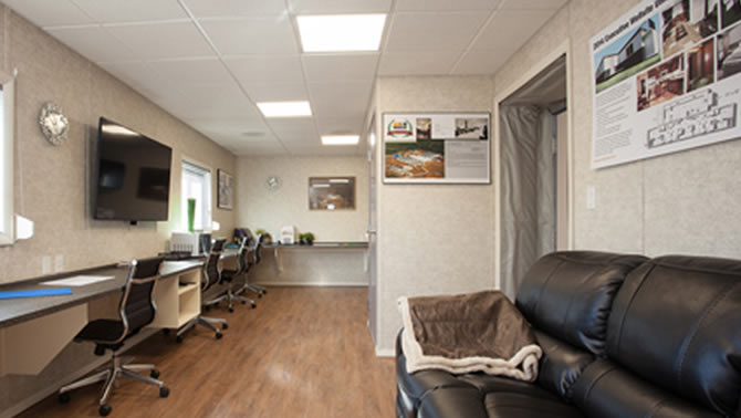 Interior of a remote living lodge with couch and comfortable chairs. 