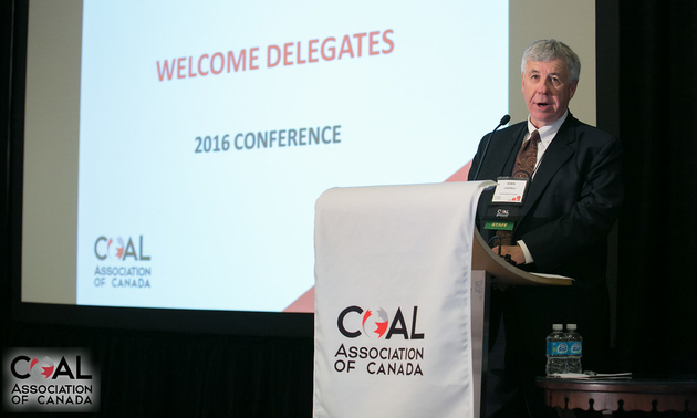 a man standing at a podium at a past year's event