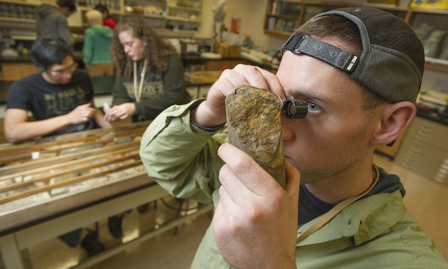 Yukon College students studying core samples in class.