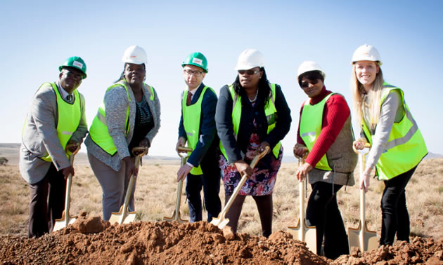 Group of officials breaking ground for an energy project. 