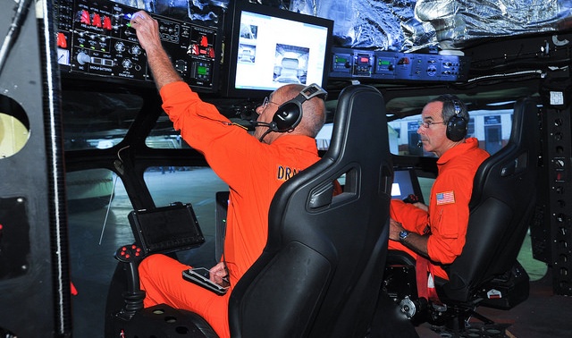 Veteran airship pilot Alfred ‘Corky’ Belanger (L), Aeroscraft Test Pilot in Command, and Test Pilot General Raymond Johns (ret.), former Commander of Air Mobility Command (USAF), check systems in advance of flight tests. 