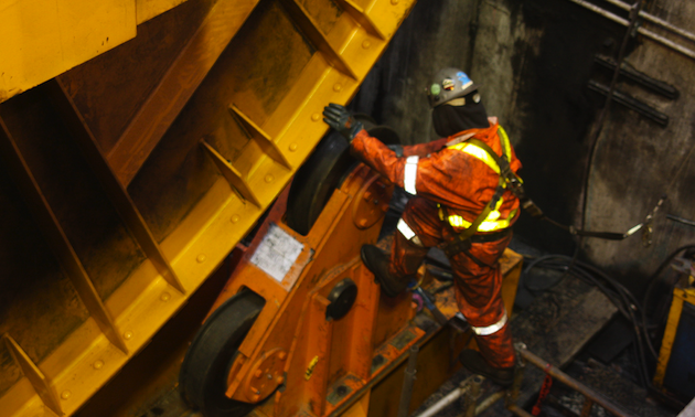Man in reflective gear and hard hat 