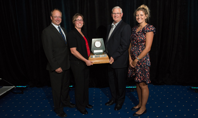 Jade Winner:  Teck Resources Limited, recipient of the Jake McDonald Annual Reclamation Award. From left to right: Dave Nikolejsin (Deputy Minister of the Ministry of Energy and Mines), Michelle Unger (Senior Environmental Scientist, Teck Resources Limited), Bruce Donald (Manager, Dormant Properties, Teck Resources Limited), Jaimie Dickson (2013 Chair, BC Technical & Research Committee on Reclamation).