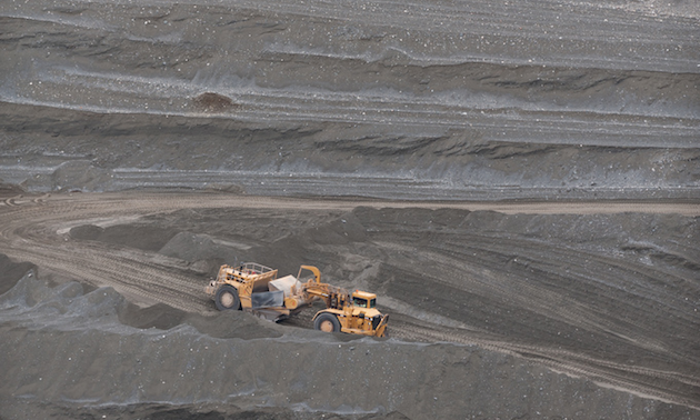 Photo of scrapers extracting sand