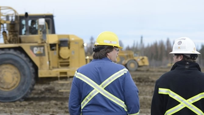 Picture of worker at Carmon Creek project in Alberta. 