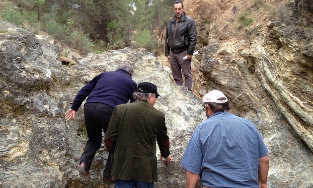 GlencoreXtrata and Solid Resources personnel climbing a massive magnetite dyke on the Cehegin property.