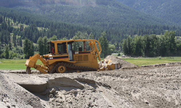 a bulldozer moving soil
