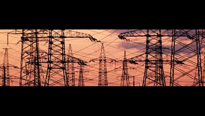 Picture of power line towers at sunset. 