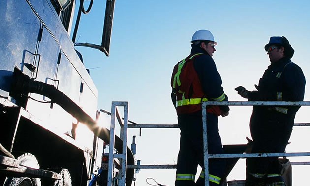Picture of two workers having a conversation.