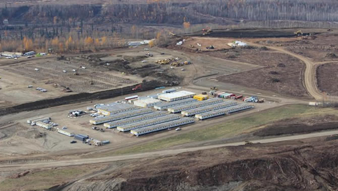 Aerial view of the north bank of the Site C dam site. Temporary trailers house ATCO workers as they build a 1,600-person worker accommodation facility.