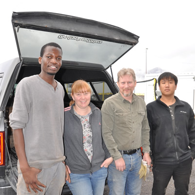 The fossils required a team effort to move. (L-R) Papa Sylla, Alison Seward, Shane Seward, Zhen Luo.