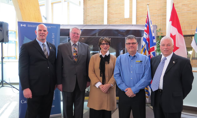 a group of people: four men and one woman