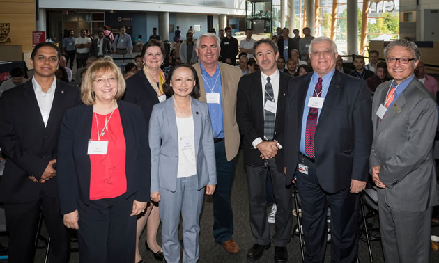 Simon Fraser University and Siemens Canada recently announced a new partnership to provide advanced manufacturing training to B.C. students and engineers. Here, people representing both institutions are lined up for the photo.