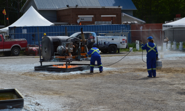 Miners start a fire in a controlled environment