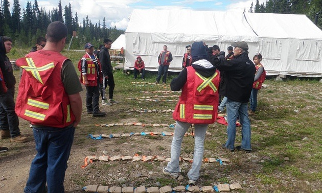 Students from the 2013 Workforce Exploration Skills (WEST) Program arrange soil samples after a field exercise.