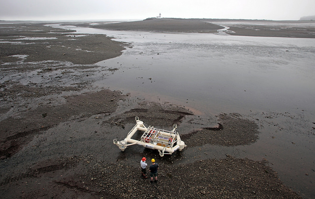 The Fundy Advanced Sensor Technology monitoring platform is being prepared  for sea trials during low tide in the Parrsboro Harbour, Minas Passage.