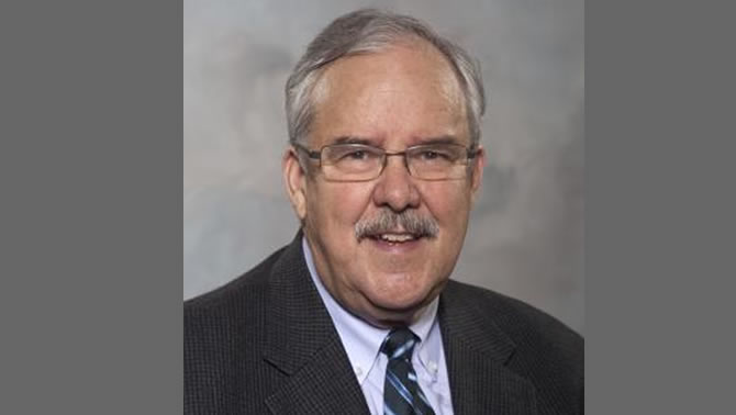 Picture of man with moustache and glasses