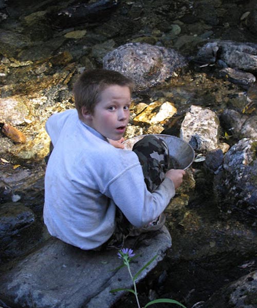 Mortensen’s son panning for gold.