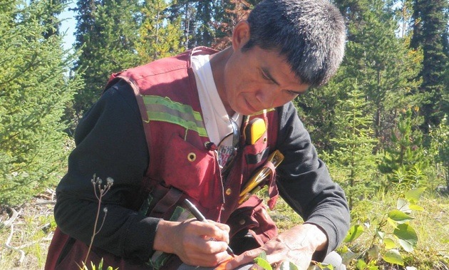 Student from the WEST program in 2013 collects data in the field.